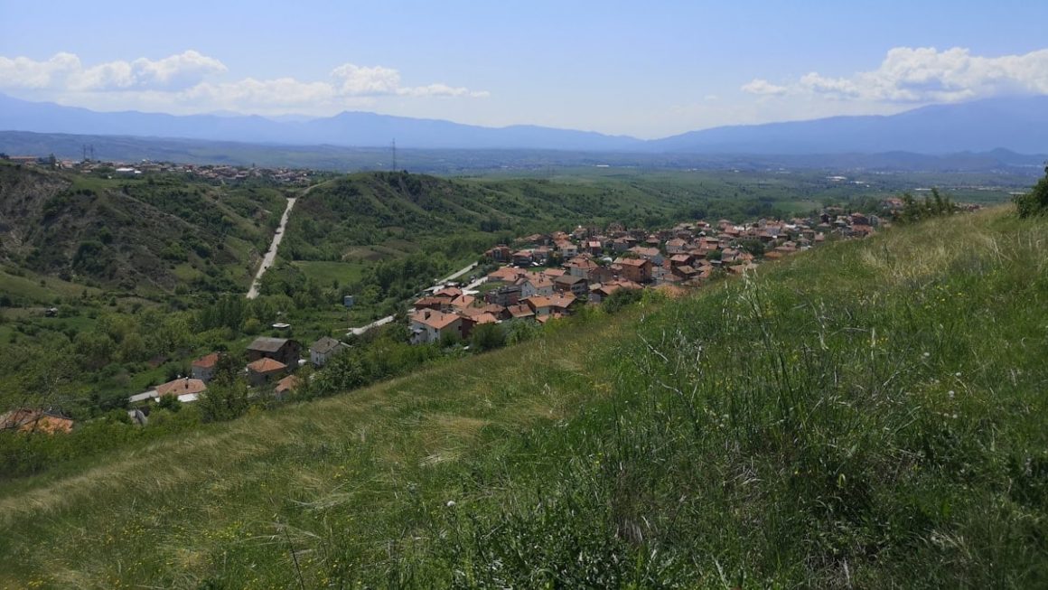 a view of a small village on a hill