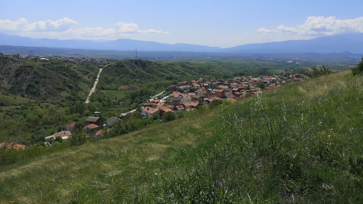 a view of a small village on a hill